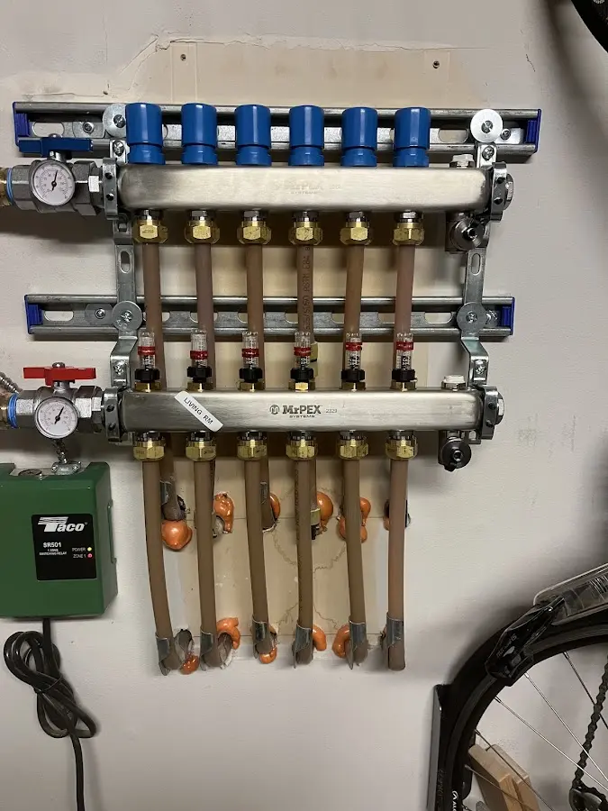 Plumber performing Water Heater Repair at a residential property in Hampden